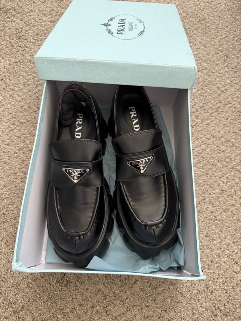 Black Leather Penny Loafers with Metal Plaque